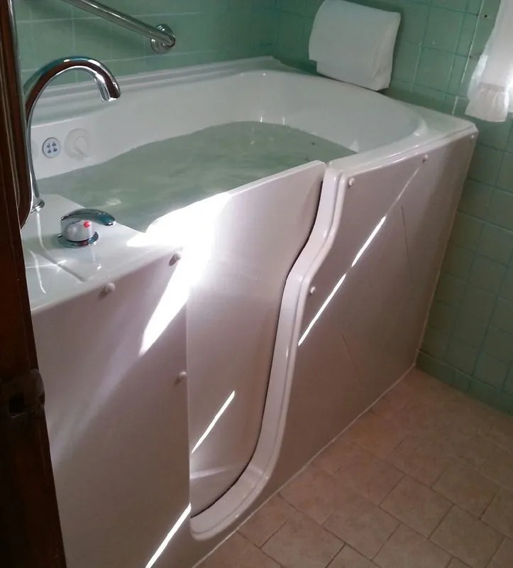 Therapeutic walk-in tub